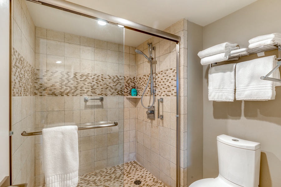 The ensuite bathroom has a separate walk-in shower.