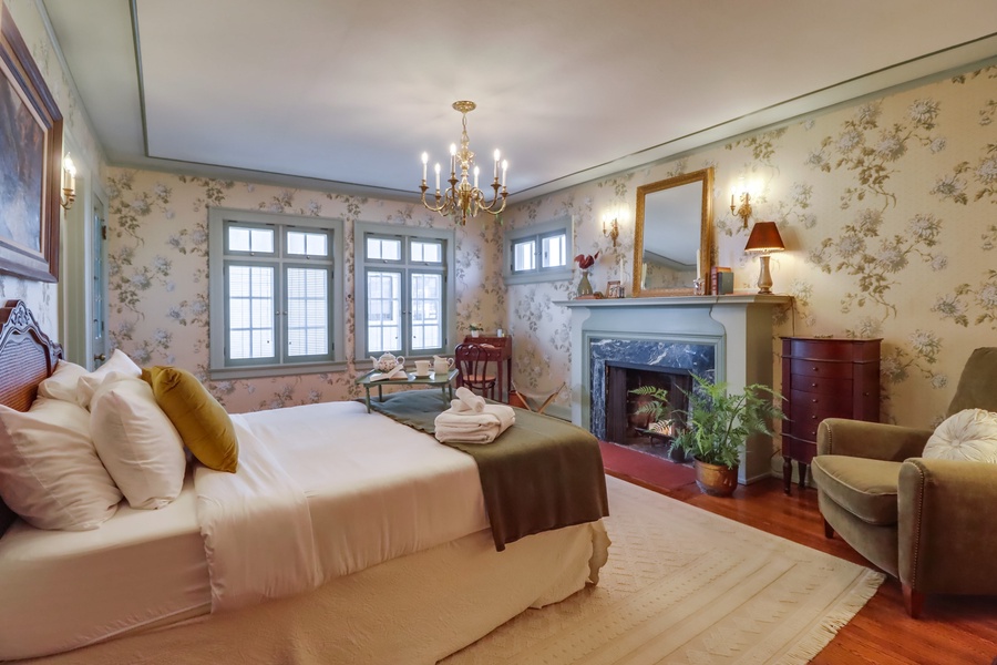 On the second level, guest room 1 features a king-sized bed, fireplace and ensuite bathroom.