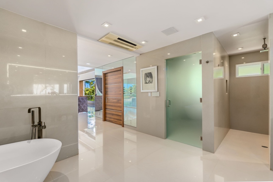 Step into your private spa-like retreat with a soaking tub, walk-in shower, and gleaming finishes that invite you to unwind in pure luxury.