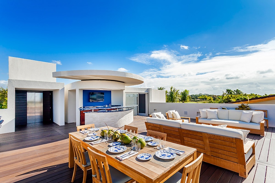 Dine al fresco on the rooftop terrace, complete with stunning views and a full outdoor kitchen.