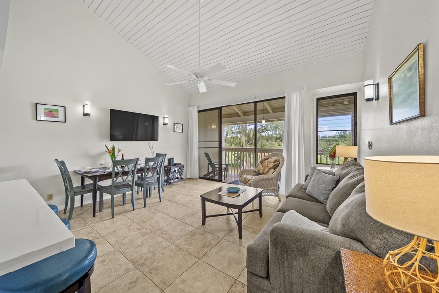 Enjoy the fully equipped kitchen, dining area, flat-screen TV, queen-sized bed, and outdoor seating overlooking the golfers passing by.