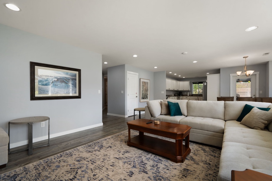 The spacious open-concept layout connects the living room, dining area, and kitchen for easy everyday living and entertaining.