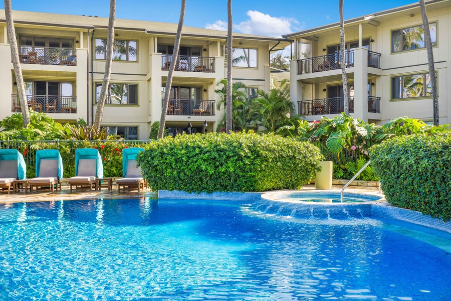 Dive into crystal-clear waters surrounded by lush tropical gardens and your comfortable poolside retreat.