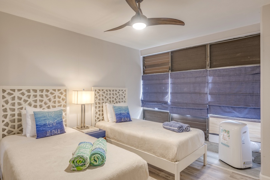 The guest bedroom has AC, outdoor views and shades for privacy.