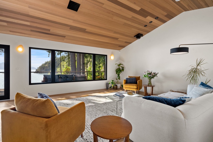 The spacious living area offers large glass windows for natural lighting.