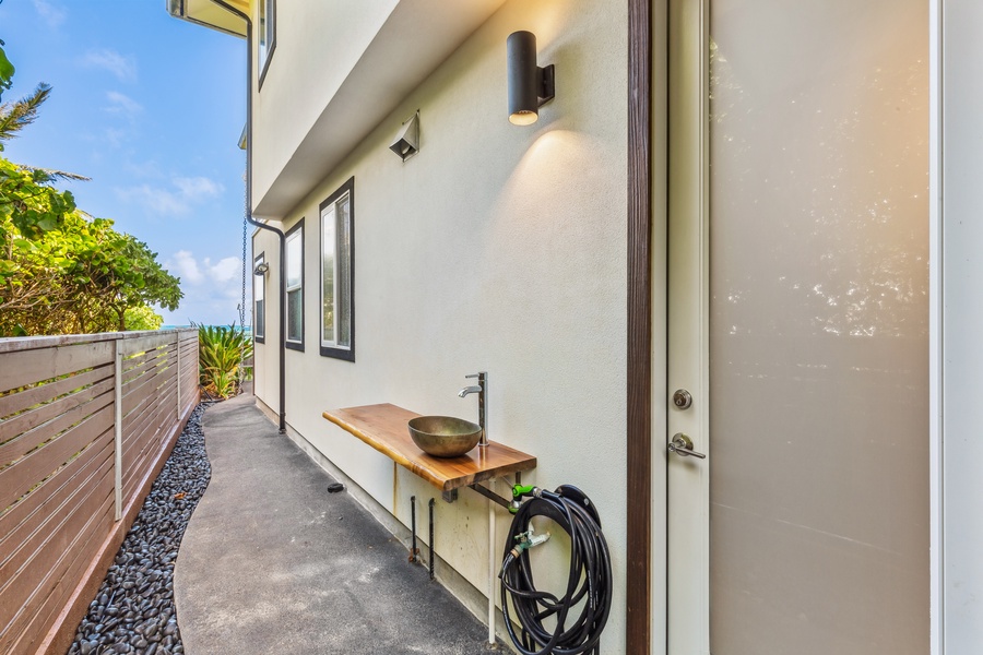 Outdoor pathway with soft lighting and clean modern design leading to the entrance.