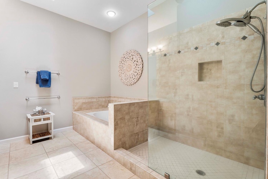 Primary ensuite offers a soaker tub and modern glass enclosed shower.