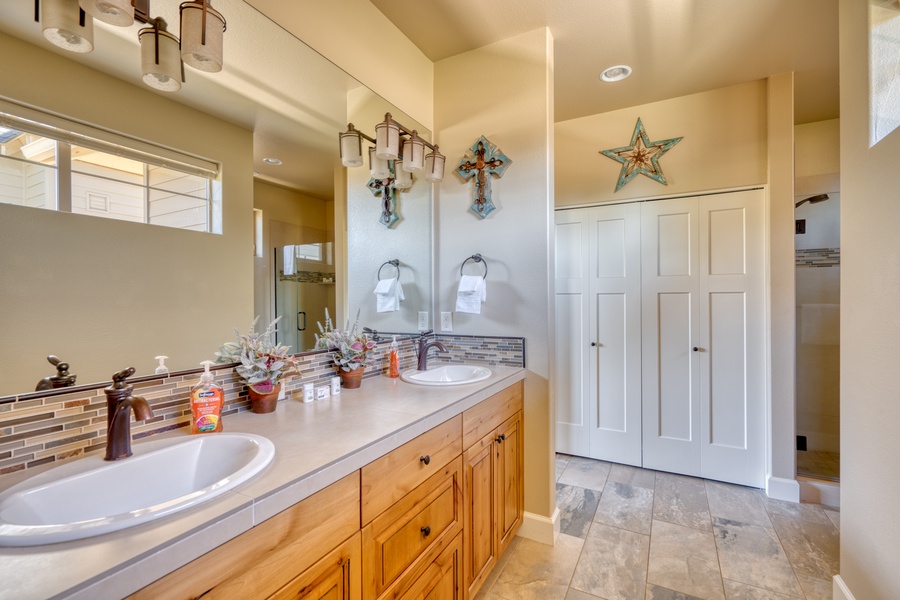 The bathroom offers plenty of counter space and dual sinks for your convenience