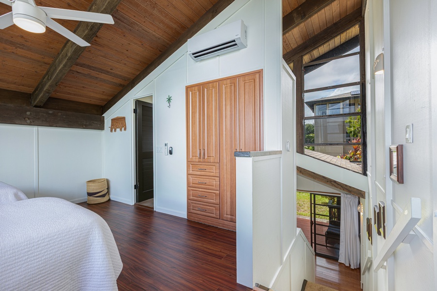 High ceilings, clean lines, and natural finishes define this relaxing king bedroom—your private haven after a day of sun and surf.