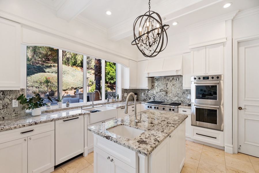 The gourmet kitchen is a chef's dream with two dishwashers, top-of-the-line professional grade appliances and every provision needed to cater a formal dinner.