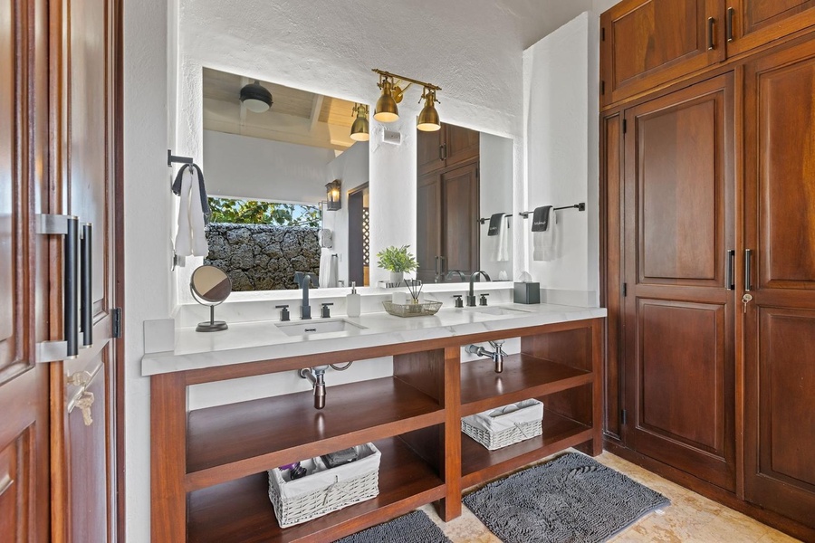 Spacious bathroom with ample counter space and storage, perfect for a comfortable and functional setup.