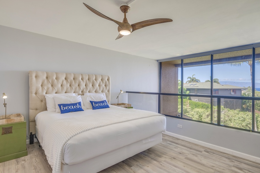 This bedroom also has ceiling fan, AC, outdoor views and TV.