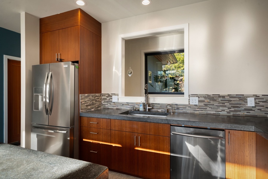 Stainless steel appliances and warm wood cabinets makes meal prep a pleasure during your stay.