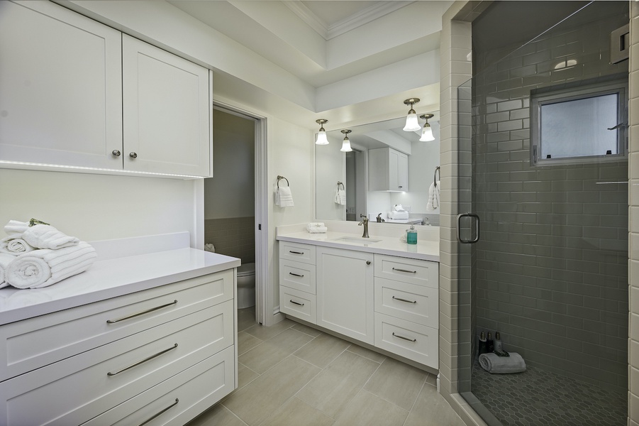 There's plenty of vanity space and a walk-in shower