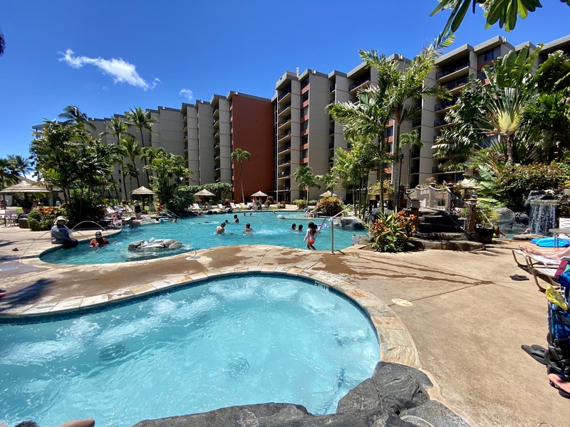 Take a refreshing dip in the resort-style pool, surrounded by tropical landscaping, perfect for a leisurely day under the Hawaiian sun.