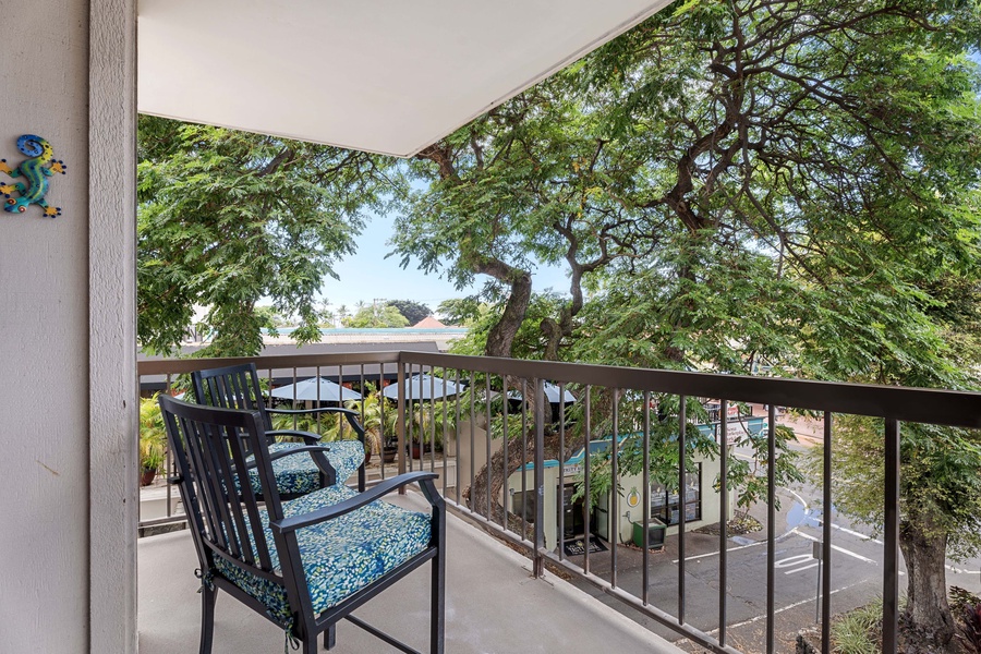 A stunning view of the lanai featuring a picturesque dining setup overlooking the pool.
