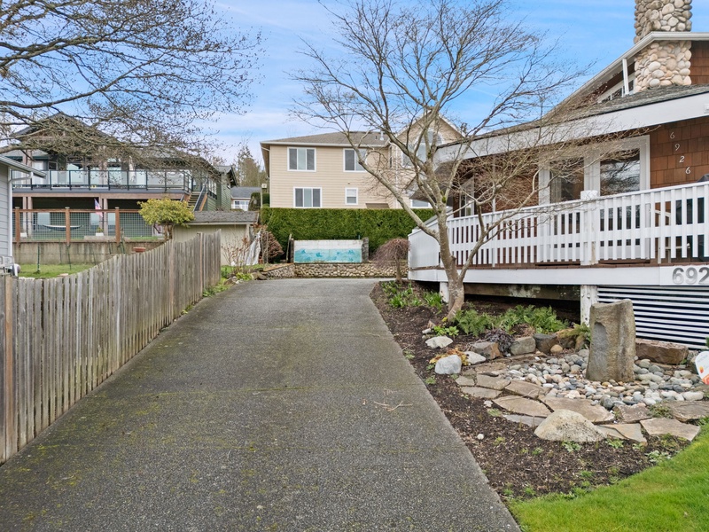 A quiet residential neighborhood with mature trees and well-maintained properties creates a peaceful setting for the vacation rental.