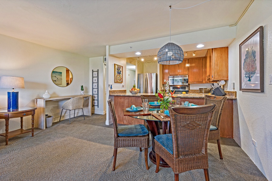 The dining area is set up for memorable meals and conversations, with comfortable seating and easy access to the kitchen for a seamless dining experience.