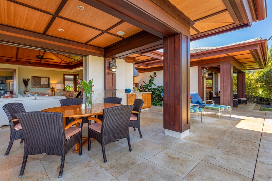 Dine alfresco in the covered outdoor dining area beside the cabana.