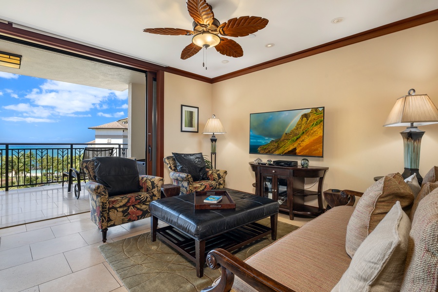 The living area has direct access to the lanai and ocean views.