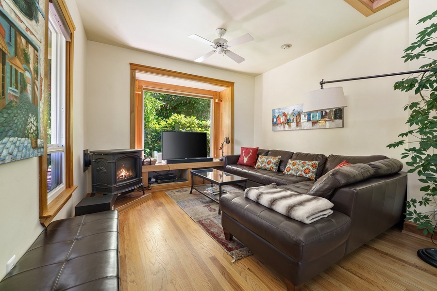 Cozy family room featuring a fireplace and sectional sofa, a great spot for movie nights or relaxation.