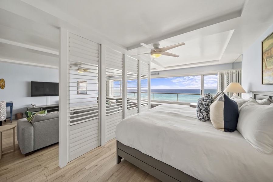 Wake up to endless ocean views from your serene bedroom suite, where crisp white linens and coastal breezes create the perfect retreat.