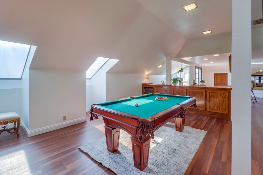 Enjoy a relaxed evening of billiards under the natural light from the skylight.