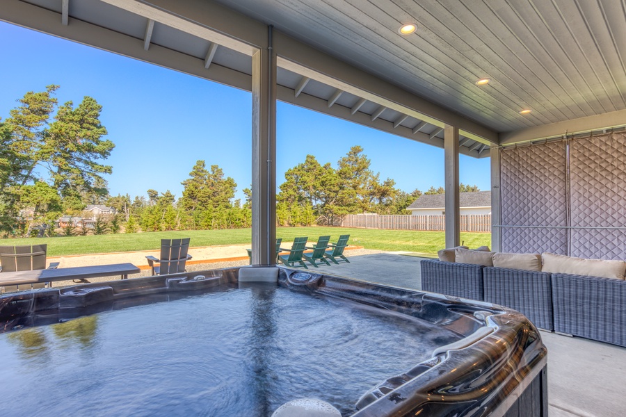 Savor the coastal charm and relax in the private hot tub of this Warrenton, OR home