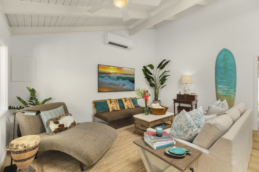 Living room features, stylish furnishings, Split A/C and large flatscreen TV
