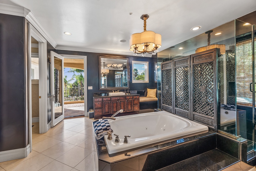 Indulge in a tranquil soak in the stylish bathtub, with outdoor views to soothe your senses.