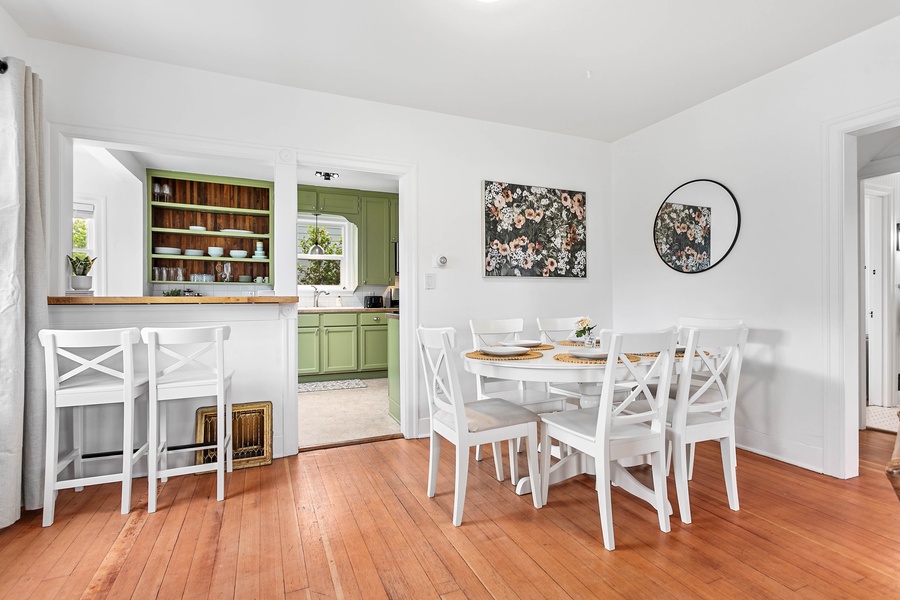 This cheerful dining nook features seating for six and easy access to the kitchen—ideal for shared meals or morning coffee.
