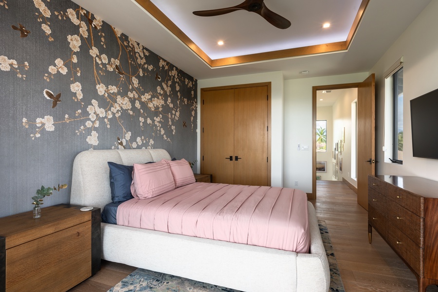 The second guest bedroom upstairs is adjacent to the primary suite (Bedroom 1) and features a queen-sized bed, TV, central AC, and a bathroom just across the hall.