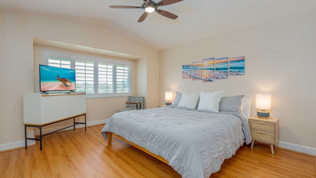 The primary guest bedroom is comfortable and spacious for a restful slumber.