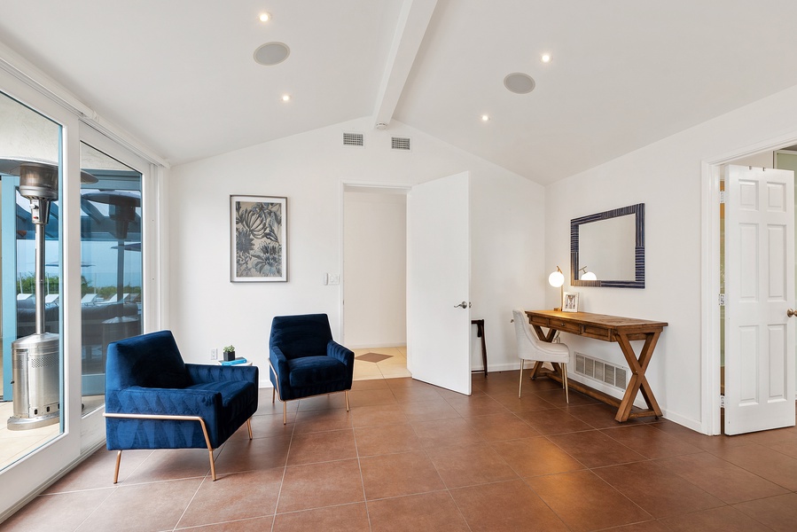 Primary bedroom seating area and writing desk