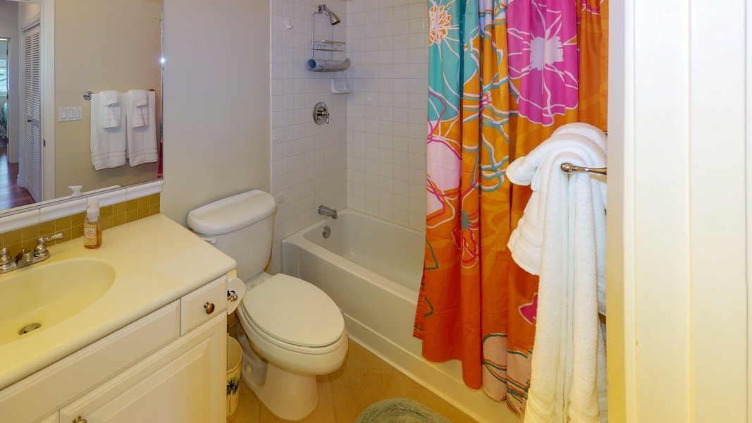 The guest bathroom has tub/shower combo.