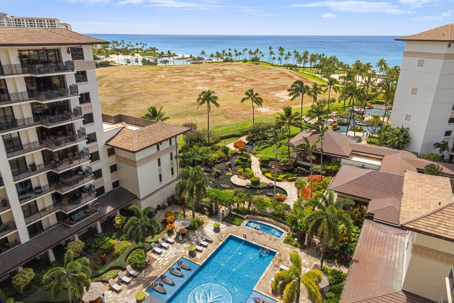 Resort pool view from the lanai with a glimpse of the ocean