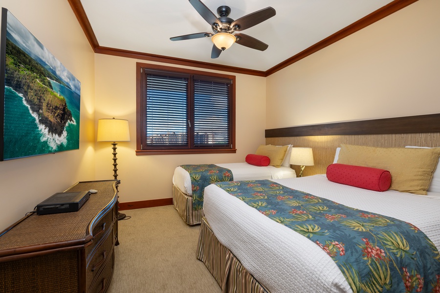 The second bedroom is perfect for families or friends, with a queen bed and twin bed combo.
