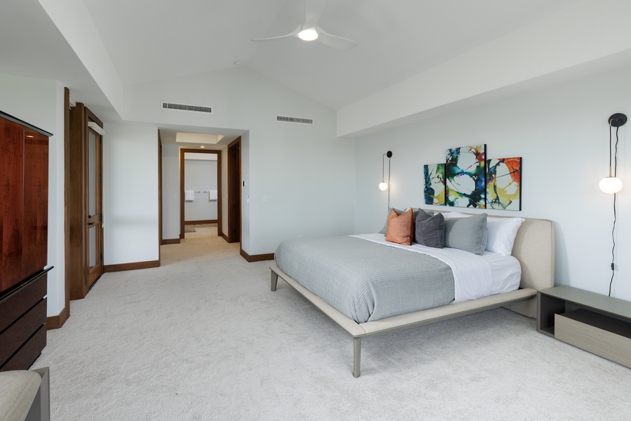 Minimalist-modern design creates a serene and bright atmosphere in this inviting guest suite.