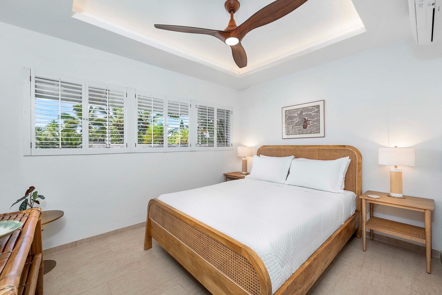 The third guest bedroom features a queen-sized bed, AC and ceiling fan.