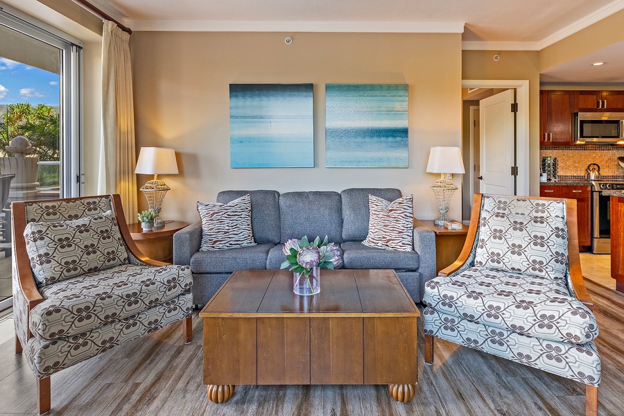 Relax in Honua Kai Konea 230/232’s living room, featuring plush seating and tropical accents