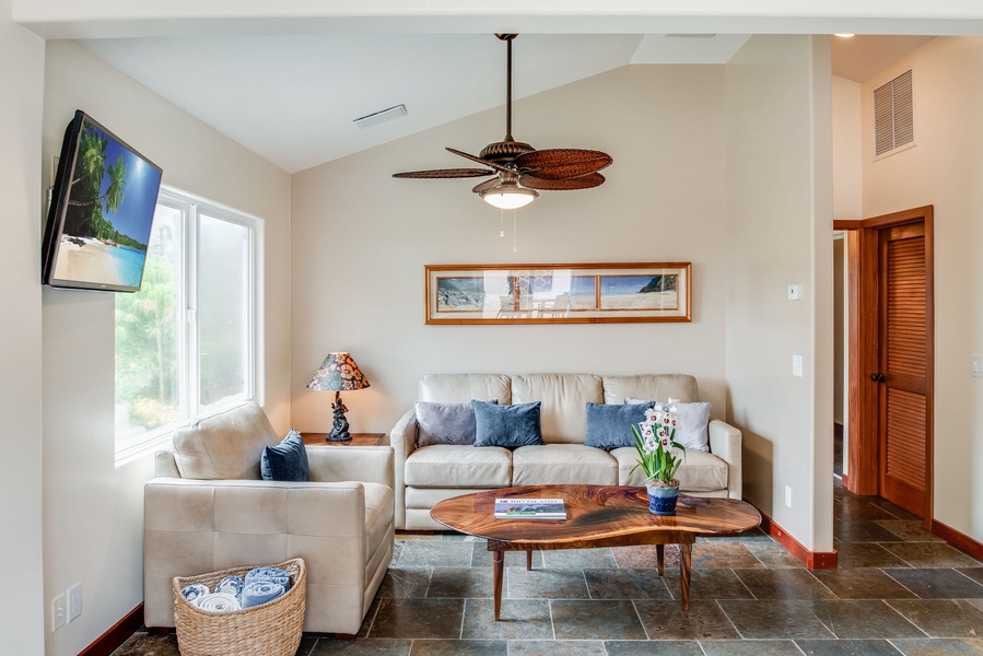 Sink into comfort in Kahakai's living area, adorned with plush sofas for ultimate relaxation.