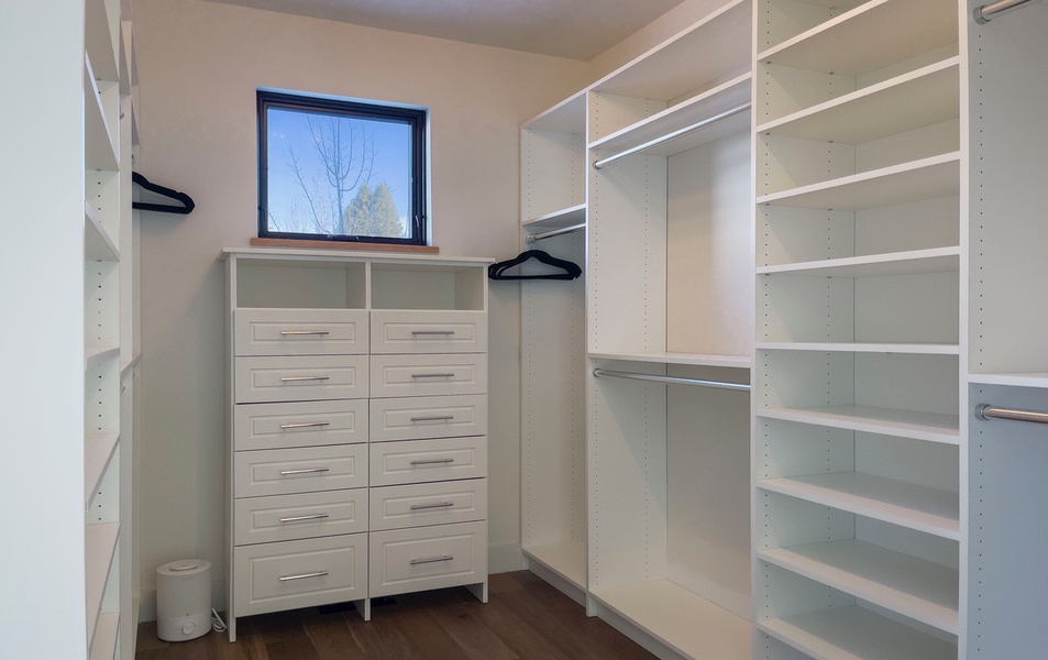 Primary guest bedroom's walk-in closet.