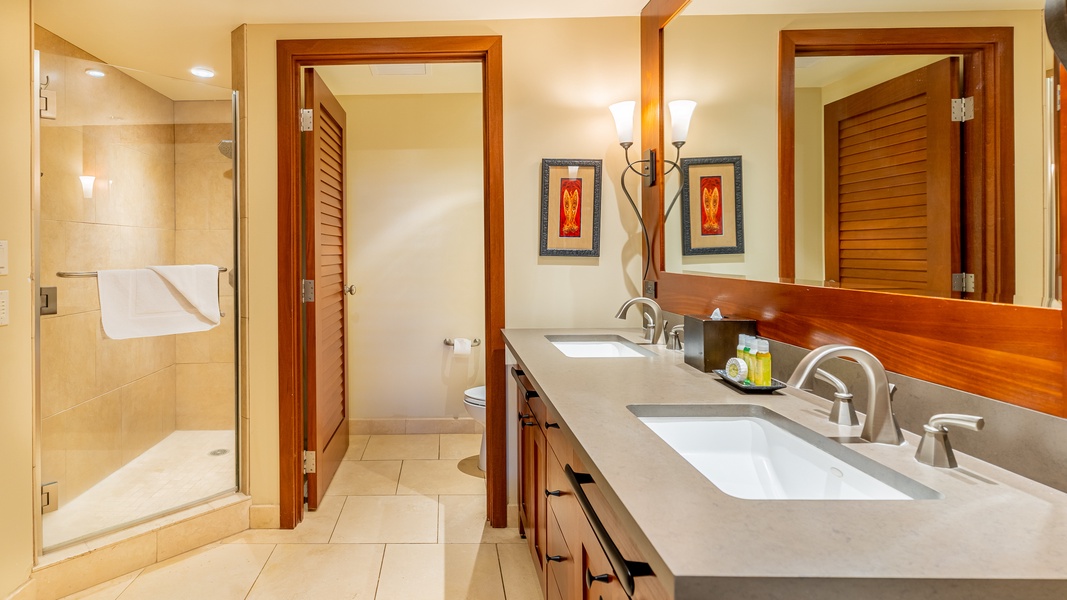 The primary guest bathroom with a shower and double vanity.