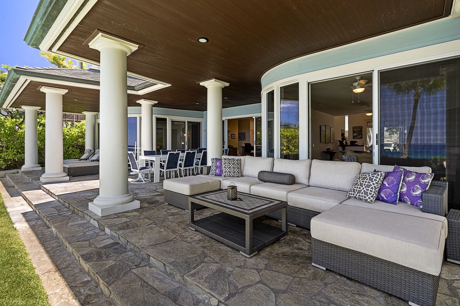 Cozy lanai seating area perfect for morning coffee or poolside supervision.