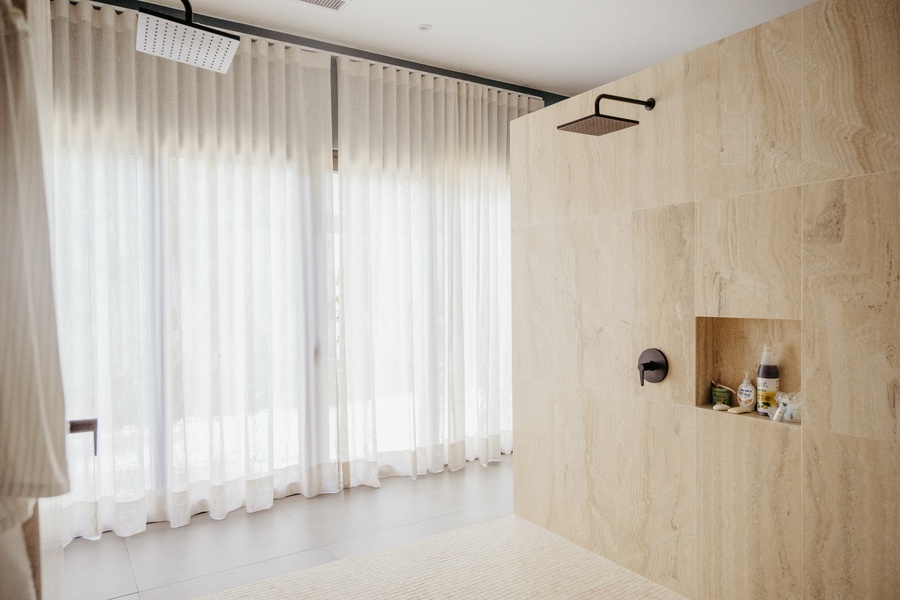 Refresh in the large walk-in shower in the primary ensuite.
