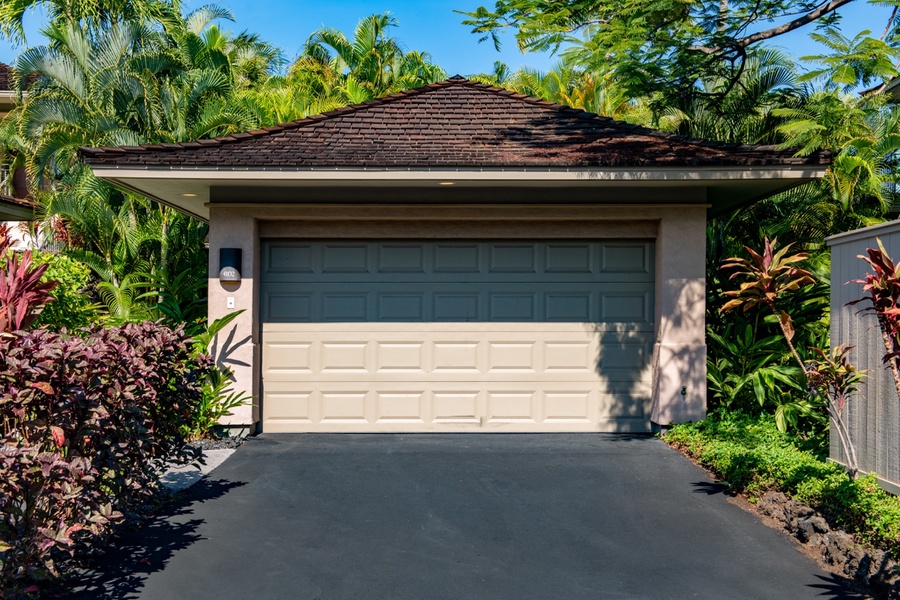 The lush green landscaping welcomes you as you enter the villa.