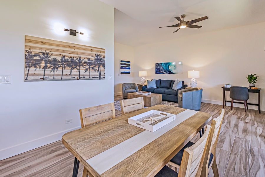 Kapalua Ridge 1421’s open dining and living area features modern decor and cozy seating.