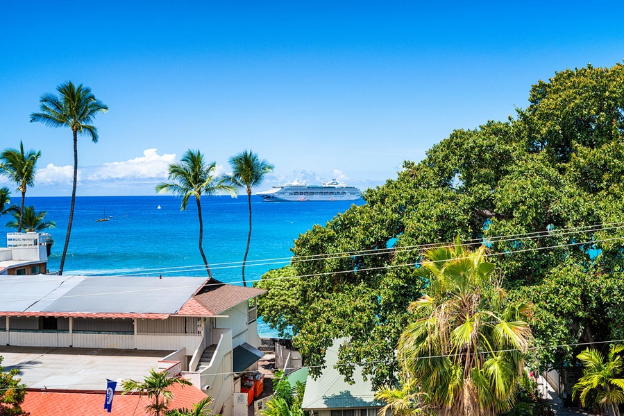 Tropical paradise with pristine blue waters, swaying palms, and a cruise ship on the horizon—a perfect Caribbean getaway location.