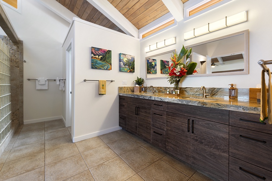 Primary Bathroom featuring A/C as well due to the vaulted ceilings