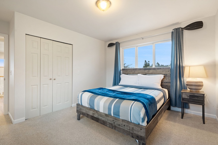 Rest peacefully in your cozy bedroom with rustic wood bed frame, crisp linens, and ample wardrobe space for your belongings.